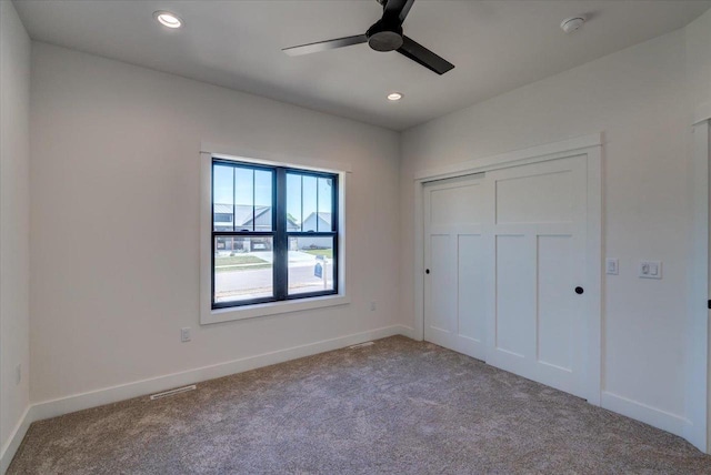 713 Kennedy St, Sauk City, WI 53583 - unfurnished bedroom featuring carpet floors, recessed lighting, baseboards, a closet, and ceiling fan