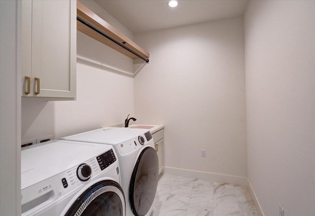 713 Kennedy St, Sauk City, WI 53583 - washroom with cabinet space, separate washer and dryer, light marble finish flooring, recessed lighting, and baseboards