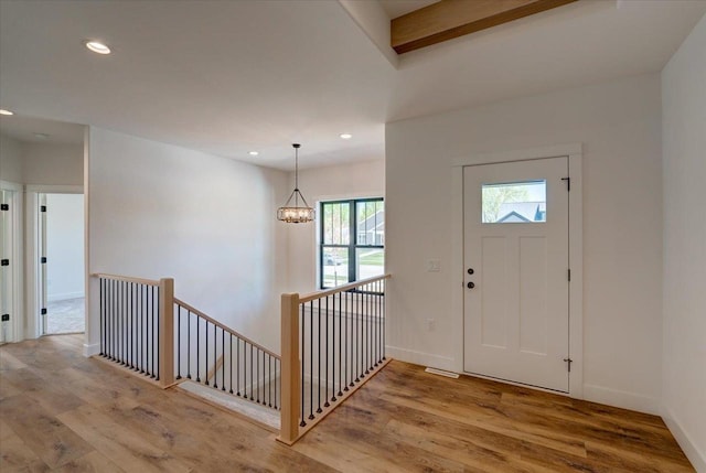 713 Kennedy St, Sauk City, WI 53583 - entrance foyer with wood finished floors, recessed lighting, a chandelier, and baseboards
