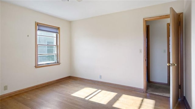 1408 E Lexington Blvd, Eau Claire, WI 54701 - spare room with wood finished floors and baseboards