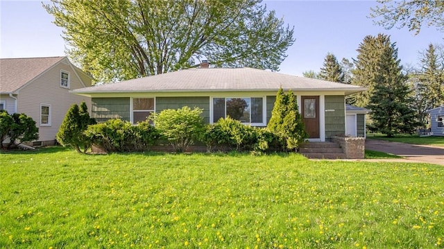 1408 E Lexington Blvd, Eau Claire, WI 54701 - view of front of home with a front yard, a chimney, and entry steps
