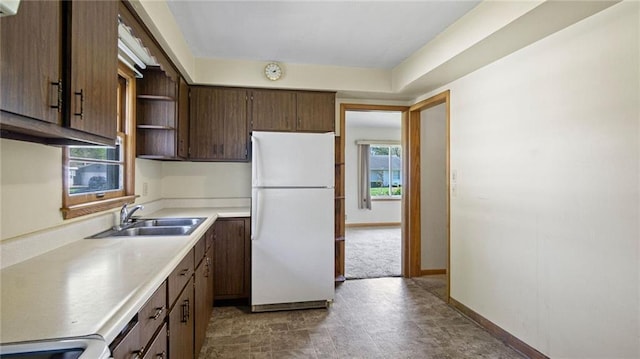 1408 E Lexington Blvd, Eau Claire, WI 54701 - kitchen featuring freestanding refrigerator, a sink, open shelves, light countertops, and plenty of natural light