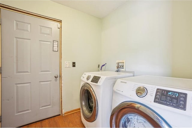 2136 62nd St, Somerset, WI 54025 - laundry area featuring washing machine and dryer and light wood-style flooring