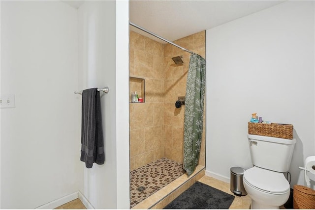 2136 62nd St, Somerset, WI 54025 - full bath with a stall shower, toilet, baseboards, and tile patterned flooring