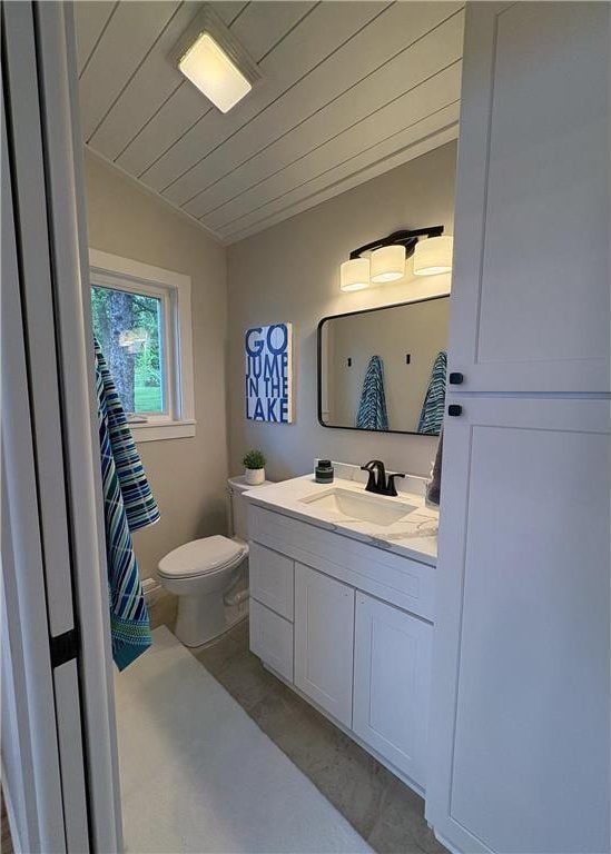 11445 State Highway 48, Luck, WI 54853 - bathroom featuring toilet, vanity, vaulted ceiling, and wooden ceiling