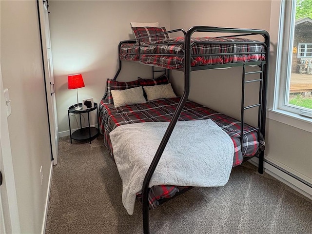 11445 State Highway 48, Luck, WI 54853 - carpeted bedroom featuring baseboards and a baseboard heating unit