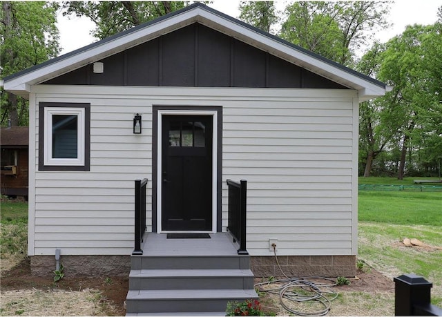 11445 State Highway 48, Luck, WI 54853 - view of front of property with board and batten siding and a front lawn