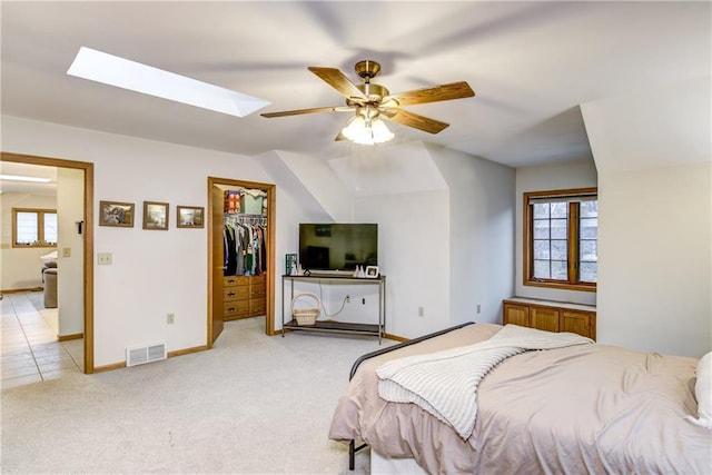 1813 Abbe Hill Dr, Eau Claire, WI 54703 - bedroom featuring a skylight, multiple windows, light colored carpet, and baseboards