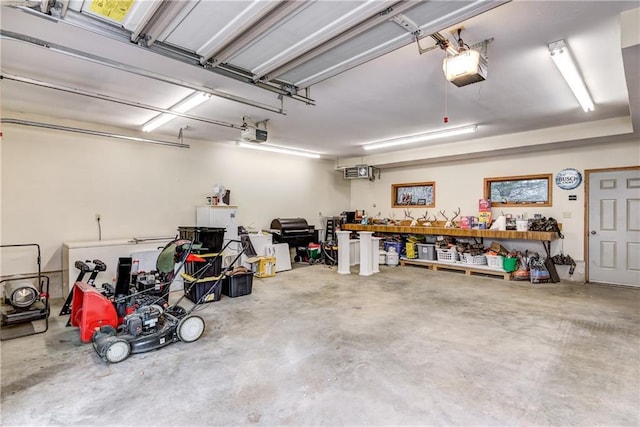 1813 Abbe Hill Dr, Eau Claire, WI 54703 - garage featuring a workshop area and a garage door opener