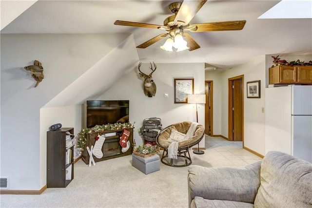 1813 Abbe Hill Dr, Eau Claire, WI 54703 - living area featuring a ceiling fan, light carpet, and baseboards