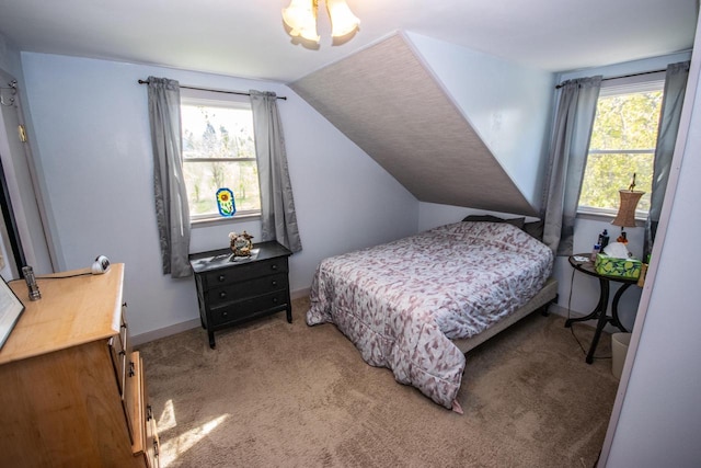 5291 Deer Rd, Hartford, WI 53027 - bedroom with multiple windows, light colored carpet, and vaulted ceiling