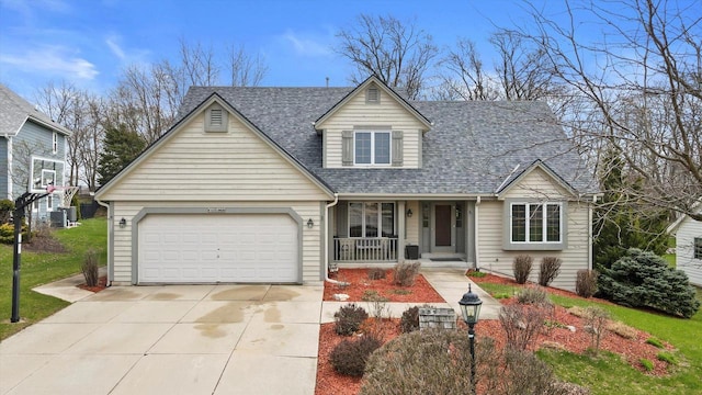 W127S9630 Scott Krause Dr, Muskego, WI 53150 - view of front of home with covered porch, concrete driveway, roof with shingles, an attached garage, and central air condition unit