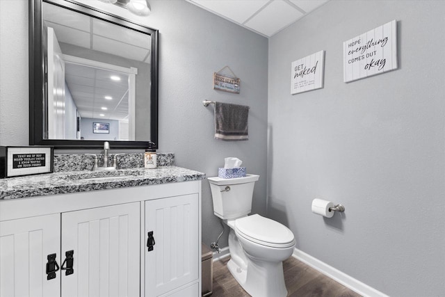W127S9630 Scott Krause Dr, Muskego, WI 53150 - bathroom featuring wood finished floors, toilet, baseboards, and vanity