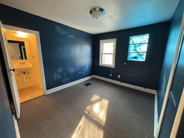 1306 W Wisconsin St, Portage, WI 53901 - unfurnished bedroom with baseboards