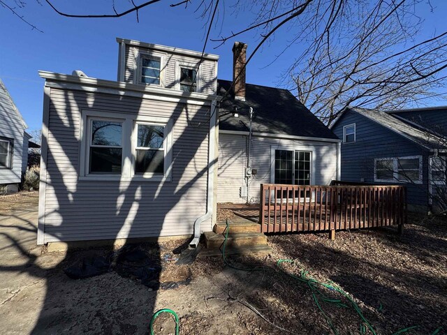 1306 W Wisconsin St, Portage, WI 53901 - rear view of property with a chimney and a deck