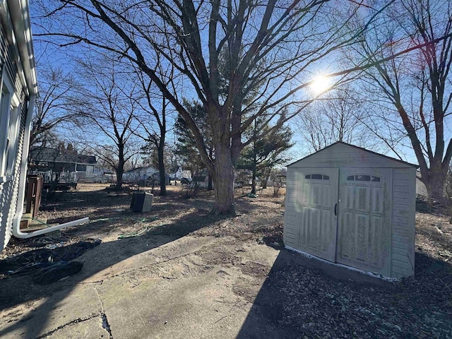 1306 W Wisconsin St, Portage, WI 53901 - view of yard featuring a storage unit and an outdoor structure