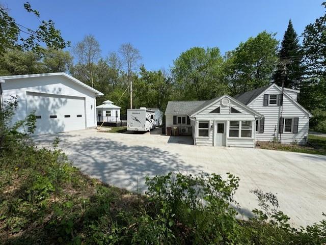 1404 Silver Mine Dr, Eau Claire, WI 54703 - view of yard featuring concrete driveway and view of scattered trees