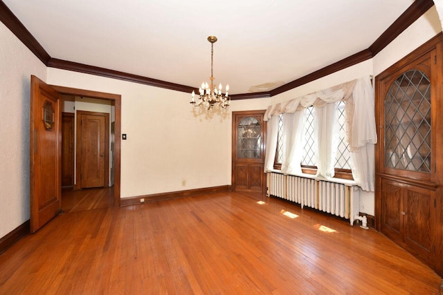 3434 N 45th St, Milwaukee, WI 53216 - unfurnished dining area featuring radiator, crown molding, hardwood / wood-style floors, a chandelier, and baseboards