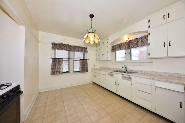 3434 N 45th St, Milwaukee, WI 53216 - kitchen featuring a sink, gas stove, light countertops, and white cabinets