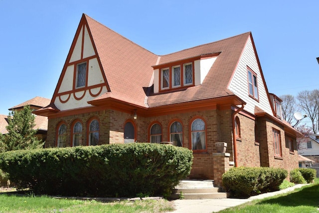 3434 N 45th St, Milwaukee, WI 53216 - tudor house featuring brick siding and a shingled roof