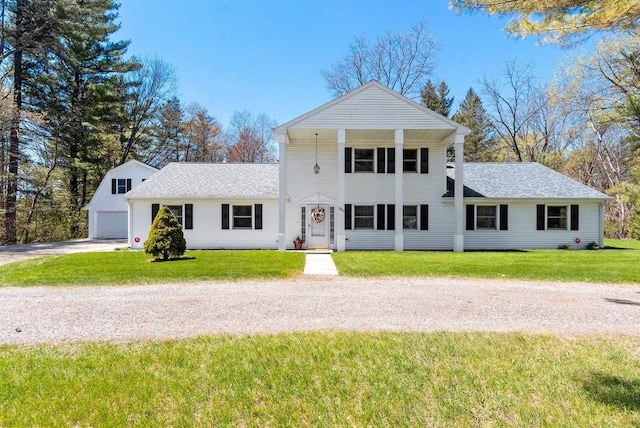 2289 Northwood Rd, Green Bay, WI 54313 - view of front of home with a front lawn, roof with shingles, driveway, and an outbuilding
