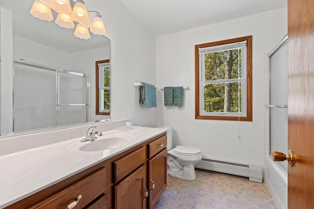 2289 Northwood Rd, Green Bay, WI 54313 - bathroom featuring a baseboard radiator, vanity, toilet, and tile patterned floors