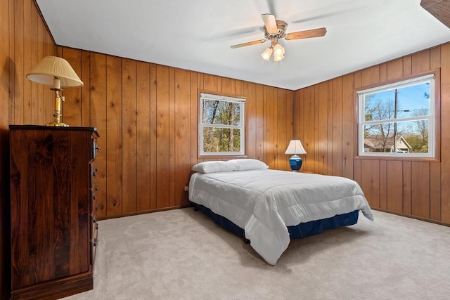 2289 Northwood Rd, Green Bay, WI 54313 - bedroom featuring light carpet, wood walls, ceiling fan, and baseboards