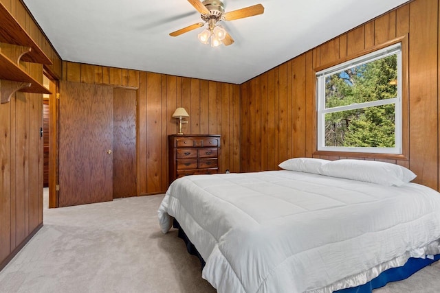 2289 Northwood Rd, Green Bay, WI 54313 - bedroom featuring light colored carpet, wooden walls, and ceiling fan