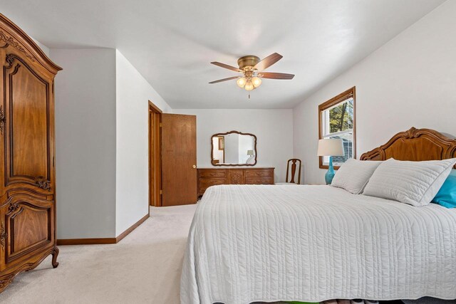 2289 Northwood Rd, Green Bay, WI 54313 - bedroom featuring light carpet, baseboards, and ceiling fan