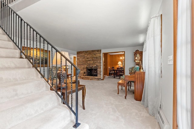 2289 Northwood Rd, Green Bay, WI 54313 - stairway featuring carpet floors, a fireplace, and a baseboard heating unit