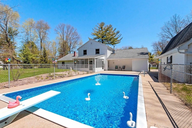 2289 Northwood Rd, Green Bay, WI 54313 - view of swimming pool with a diving board, fence, and a sunroom
