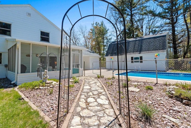 2289 Northwood Rd, Green Bay, WI 54313 - rear view of house featuring fence, a sunroom, and a shingled roof