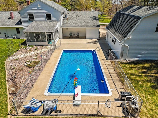 2289 Northwood Rd, Green Bay, WI 54313 - view of swimming pool with a sunroom and a patio