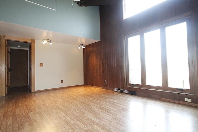 N3177 14th Dr, Montello, WI 53949 - unfurnished living room with a high ceiling, light wood finished floors, and ceiling fan