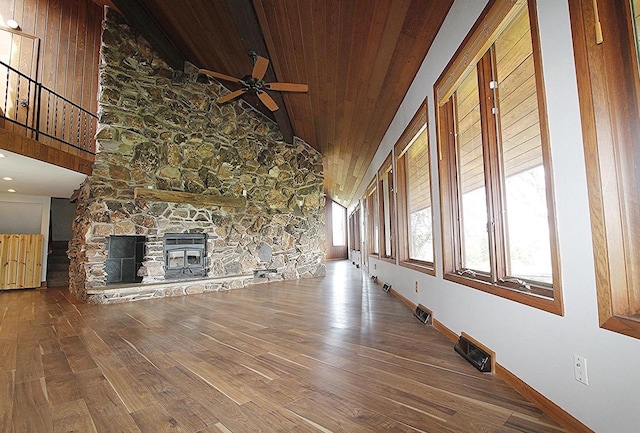 N3177 14th Dr, Montello, WI 53949 - unfurnished living room featuring wood finished floors, ceiling fan, wooden ceiling, baseboards, and high vaulted ceiling