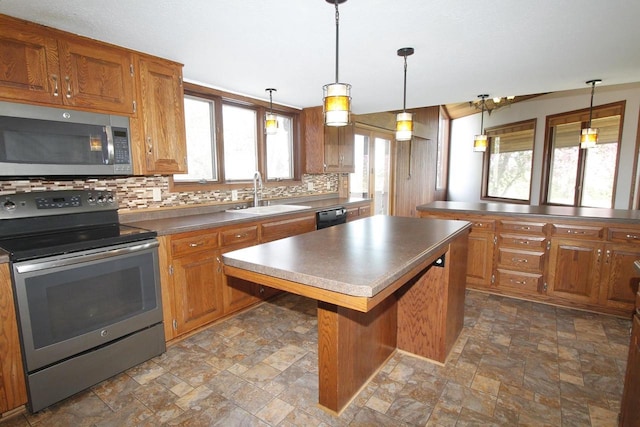 N3177 14th Dr, Montello, WI 53949 - kitchen featuring appliances with stainless steel finishes, a sink, stone finish flooring, and backsplash
