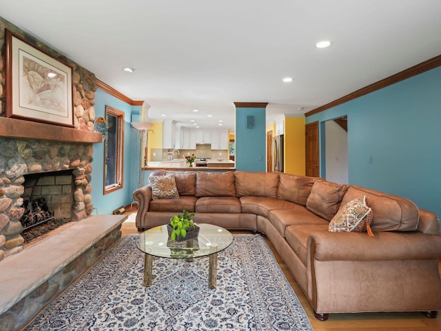 18585 Woodberry Ct, Brookfield, WI 53045 - living area with ornamental molding, recessed lighting, a fireplace, and light wood-style flooring