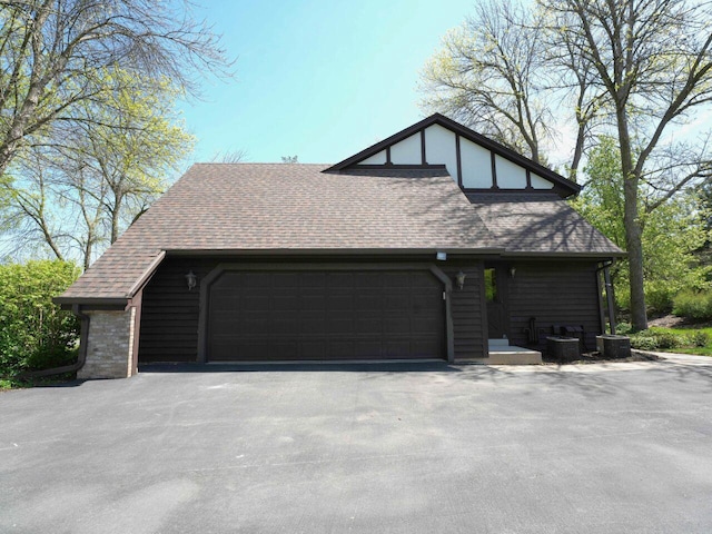 18585 Woodberry Ct, Brookfield, WI 53045 - view of side of property with a garage and a shingled roof
