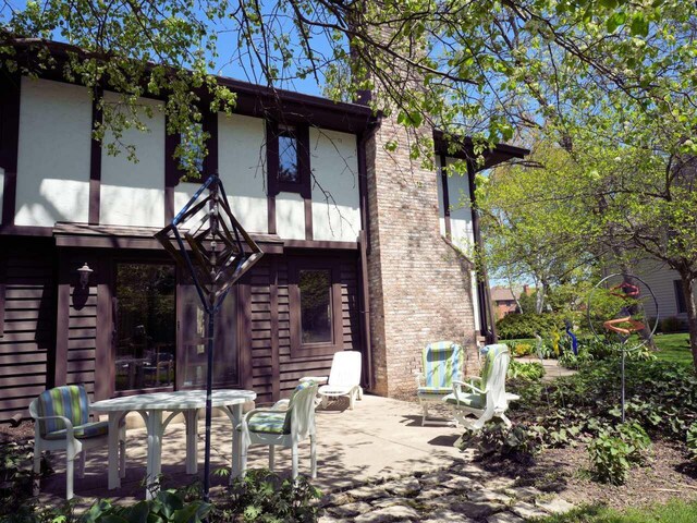 18585 Woodberry Ct, Brookfield, WI 53045 - back of house featuring a patio and stucco siding