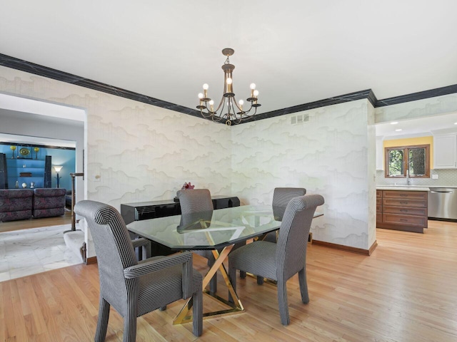 18585 Woodberry Ct, Brookfield, WI 53045 - dining area with crown molding, a chandelier, and light wood-type flooring