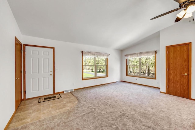 N11598 Helgeson Rd, Iola, WI 54945 - foyer with light colored carpet, lofted ceiling, a ceiling fan, and baseboards