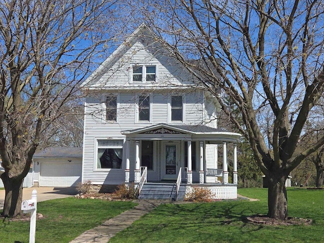 290 S Bridge St, Markesan, WI 53946 - american foursquare style home with covered porch, a front lawn, and a garage
