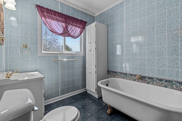 290 S Bridge St, Markesan, WI 53946 - full bath featuring toilet, a freestanding bath, a sink, ornamental molding, and tile walls