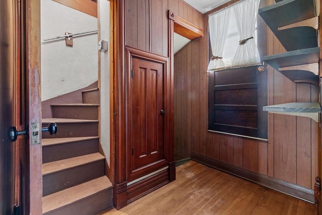 290 S Bridge St, Markesan, WI 53946 - interior space with hardwood / wood-style flooring and wooden walls