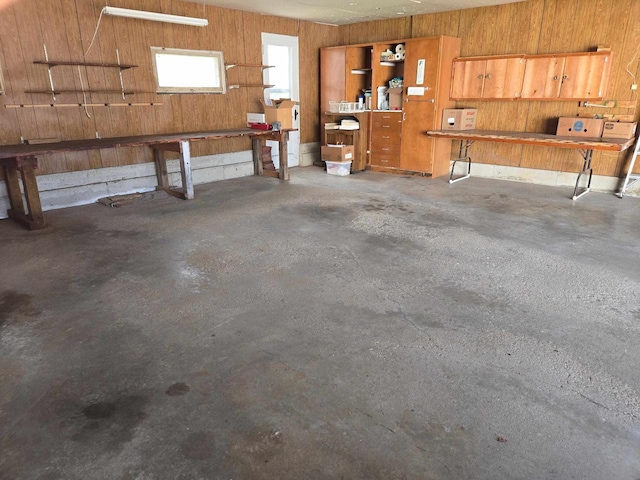 290 S Bridge St, Markesan, WI 53946 - garage featuring a workshop area and wood walls