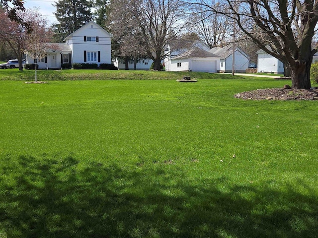 290 S Bridge St, Markesan, WI 53946 - view of green lawn with a garage
