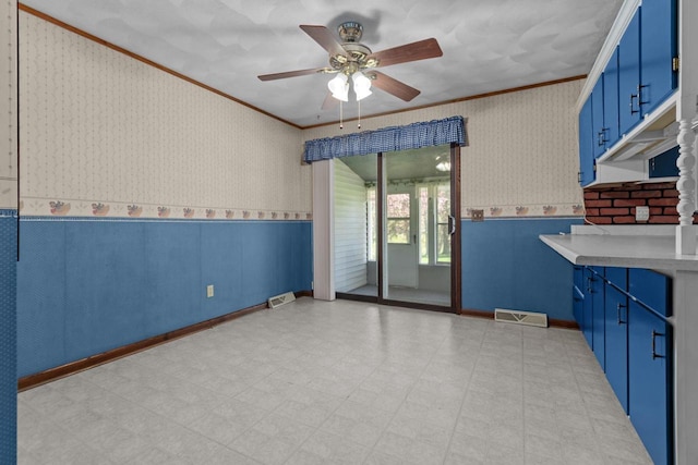 290 S Bridge St, Markesan, WI 53946 - spare room with wallpapered walls, ornamental molding, wainscoting, ceiling fan, and light floors