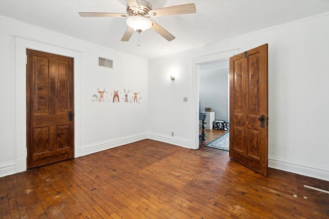 301 S Farmer St, Princeton, WI 54968 - spare room with wood-type flooring, ceiling fan, crown molding, and baseboards