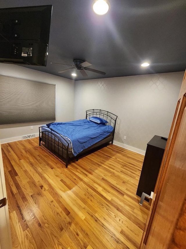 1120 W Blackhawk Dr, Fort Atkinson, WI 53538 - bedroom with wood finished floors, baseboards, recessed lighting, and ceiling fan