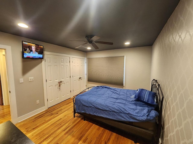 1120 W Blackhawk Dr, Fort Atkinson, WI 53538 - bedroom featuring light wood-style flooring, two closets, recessed lighting, baseboards, and a ceiling fan